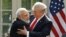 India's Prime Minister Narendra Modi hugs U.S. President Donald Trump as they give joint statements in the Rose Garden of the White House in Washington on June 26.