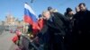 Vygaudas Usackas, head of an EU delegation to Russia, lays flowers on February 28 with other ambassadors of EU member states at the spot where Russian opposition leader Boris Nemtsov was shot dead in Moscow.