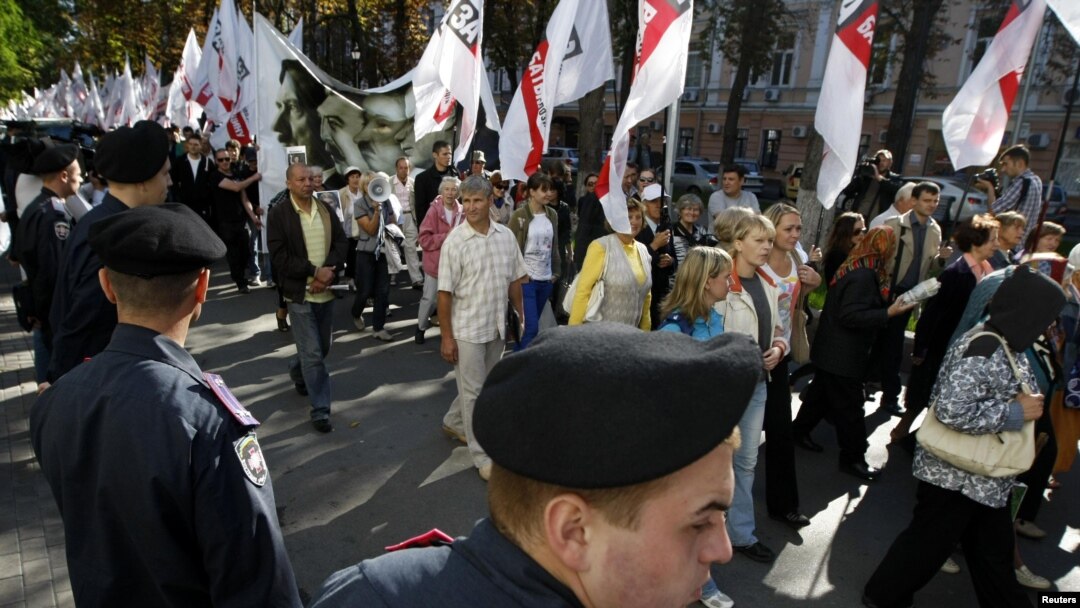 Supporters of Yulia Tymoshenko march on the street near the high court building in Kyiv on August 21.