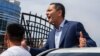 Omurbek Babanov greets supporters at Manas Airport outside Bishkek on August 9. 