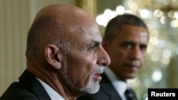 U.S. President Barack Obama (R) and Afghanistan President Ashraf Ghani address a joint news conference in the East Room of the White House in Washington on March 24. 