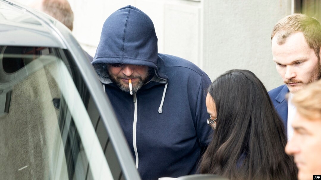 Defendant Yury Harauski enters a court building in Switzerland on the first day of hearings on September 19.