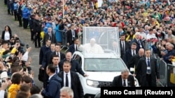 Pope Francis waves as he arrives at the Marian Shrine in Sumuleu Ciuc on June 1. 