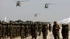 US-made Black Hawk helicopters fly during a military parade in August 2024 at Bagram to mark the third anniversary of the withdrawal of US-led troops from Afghanistan.