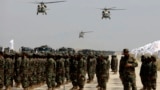 US-made Black Hawk helicopters fly during a military parade in August 2024 at Bagram to mark the third anniversary of the withdrawal of US-led troops from Afghanistan.