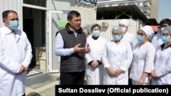 Kyrgyz President Sadyr Japarov inspects a medical facility in Bishkek on April 15.