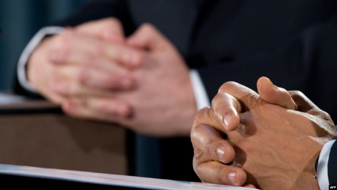 The hands of British Prime Minister Gordon Brown (left) and U.S. President Barack Obama are pictured as they addressed a joint press conference in London on April 1.