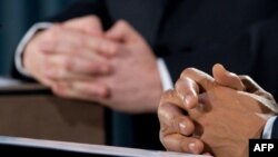 The hands of British Prime Minister Gordon Brown (left) and U.S. President Barack Obama are pictured as they addressed a joint press conference in London on April 1.