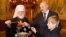 Мітрапаліт Павел разам з Аляксандрам Лукашэнкам і ягоным сынам Мікалаем