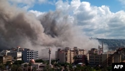 Smoke rises after an Israeli air strike that targeted an area in the southern Lebanese city of Sidon on April 8.