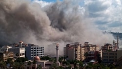 Smoke rises from the site of an Israeli air strike that targeted an area in the southern Lebanese city of Sidon on April 8.