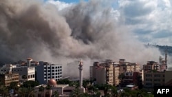 Smoke rises from the site of an Israeli air strike that targeted an area in the southern Lebanese city of Sidon on April 8.
