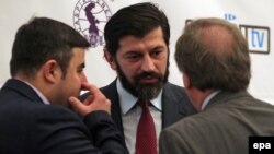 Georgia -- Georgian Energy Minister Kakha Kaladze (C) speaks with delegates during the14th Georgian International Oil, Gas, Infrastructure and Energy Conference in Tbilisi, March 25, 2015