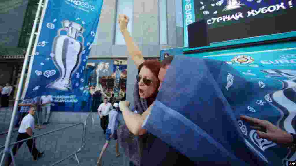 Ukraine -- Security officers detain activists of women's movement FEMEN who attacked an EURO 2012 tournament trophy during its display in city of Dnipropetrovsk, 21May2012