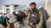 A policeman stands guard outside a Jamaat-e Tabligh mosque in Peshawar.