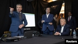 US President Donald Trump, CIA Director John Ratcliffe (center) and defense chief Pete Hegseth watch the US military operation taking place in Venezuela.