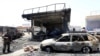 Afghan security forces inspect the site of a suicide attack in the eastern Afghan city of Jalalabad on July 10.