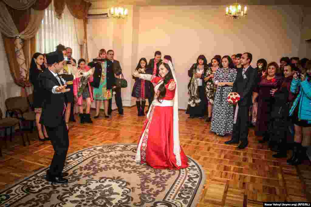 The bride and groom take the lead in dancing after the civil formalities have been taken care of.&nbsp;