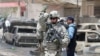 A U.S. soldier at the site of a May car bomb blast in Baghdad