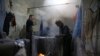  steam rises from a vat of dye as a batch of thread is prepared to be used for hand-woven carpets, in a workshop at the grand bazaar in the ancient city Kashan, Iran.(AP Photo/Vahid Salemi)