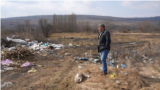 Moldova, Iacob Ursachi, mayor of the village of Vanatori, Nisporeni rayon, looks at an unauthorized garbage dump in the village.