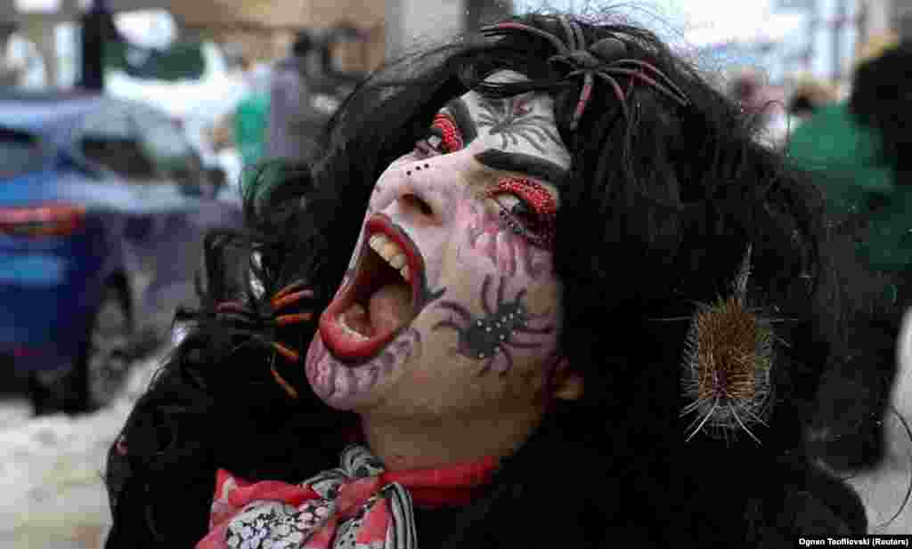 A reveler participates in a parade during a carnival to mark the beginning of the Orthodox New Year in the village of Vevcani, North Macedonia.&nbsp;