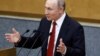 Russian President Vladimir Putin delivers a speech during a session of the State Duma in Moscow on March 10.