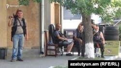 Armenia -- Armen Bilian (L) and other opposition gunmen occupy a police station in Yerevan in July 2016.