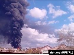 Пожар на нефтебазе в Феодосии после атаки ВСУ, октябрь 2024 года