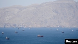 The US will 'guide' ships from 'neutral' countries that have been stranded around the Strait of Hormuz, President Donald Trump said.