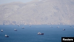 The US will 'guide' ships from 'neutral' countries that have been stranded around the Strait of Hormuz, President Donald Trump said.