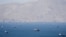 The US will 'guide' ships from 'neutral' countries that have been stranded around the Strait of Hormuz, President Donald Trump said.