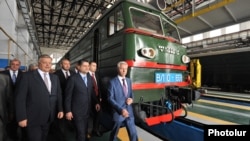 Armenia - Vladimir Yakunin (L), chief of Russia's state railway, and Prime Minister Tigran Sarkisian inaugurate a new rail depot in Gyumri, 28May2013.