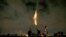 Iranians light fireworks during a celebration, known as "Chaharshanbe Souri," or Wednesday Feast, marking the eve of the last Wednesday of the solar Persian year, Tuesday, March 19, 2019 in in Tehran, Iran. Iran's many woes briefly went up in smoke on Tue