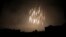 A photo shows what appears to be white phosphorus incendiaries landing during Syrian bombardment in Douma last month.