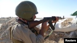 Iraqi security forces take part in an intensive security deployment against Islamic State militants in the town of Amiriyat al-Fallujah in Anbar Province on November 9.