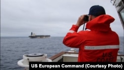 US Coast Guard personnel observe a Russian shadow fleet tanker that was seized by American forces on January 7. 