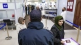 A Russian police officer keeps watch at a migration center in Novosibirsk. (file photo)