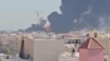 Smoke billows near the oil facility in Mangaf, Kuwait, on July 18.