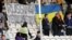 Плякат на матчы Ўкраіна — Шатляндыя на стадыёне ў польскім Кракаве з надпісам «Расея — тэрарыстычная дзяржава», 2022 год. Праз расейскую агрэсію ўкраінскія каманды вымушаныя гуляць міжнародныя матчы за мяжой