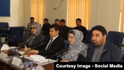 FILE: Najibullah Ahmadzai the former chairman of Independent Election Commission (R) during a meeting in Kabul.