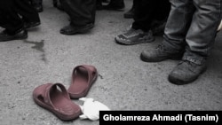 The slippers of a prisoner just after his public execution in 2016.
