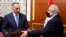 Former Iraqi Prime Minister Adel Abdul Mahdi (R) hands over to new Prime Minister Mustafa al-Kadhimi in Baghdad, Iraq, May 7, 2020