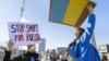 Protesters rally against Russia's full-scale invasion of Ukraine outside the United Nations in Geneva on February 26, 2022. 