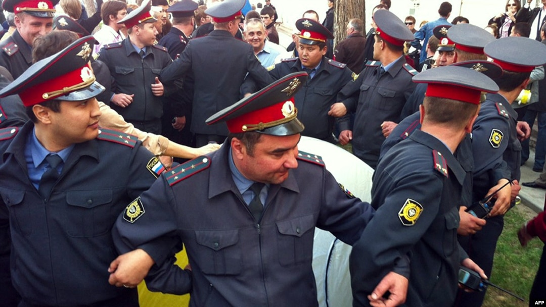 Russian police cordon off activists in Astrakhan on April 10.
