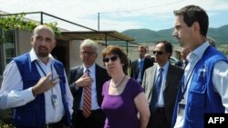 EU foreign-affairs chief Catherine Ashton (center) speaks with members of the EU monitoring mission near the Georgia-South Ossetia border zone in Tserovani earlier this month.