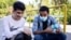 Iran, Tehran -- Two blind Iranian teenagers smiling in Coronavirus pandemic. September 25, 2021.