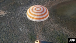 The Soyuz MS-03 space capsule carrying the International Space Station (ISS) crew of Russian cosmonaut Oleg Novitskiy and French astronaut Thomas Pesquet lands in a remote area of Kazakhstan.