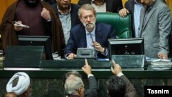 Speaker of Parliament, Ali Larijani, in the impeachment of Iran's labor, Ali Rabiei, 2018. 