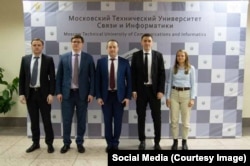 In 2021, Denis Oberzko (second from right) spoke at a Moscow technical university. He was identifed as an employee of the Emergency Situations Ministry.
